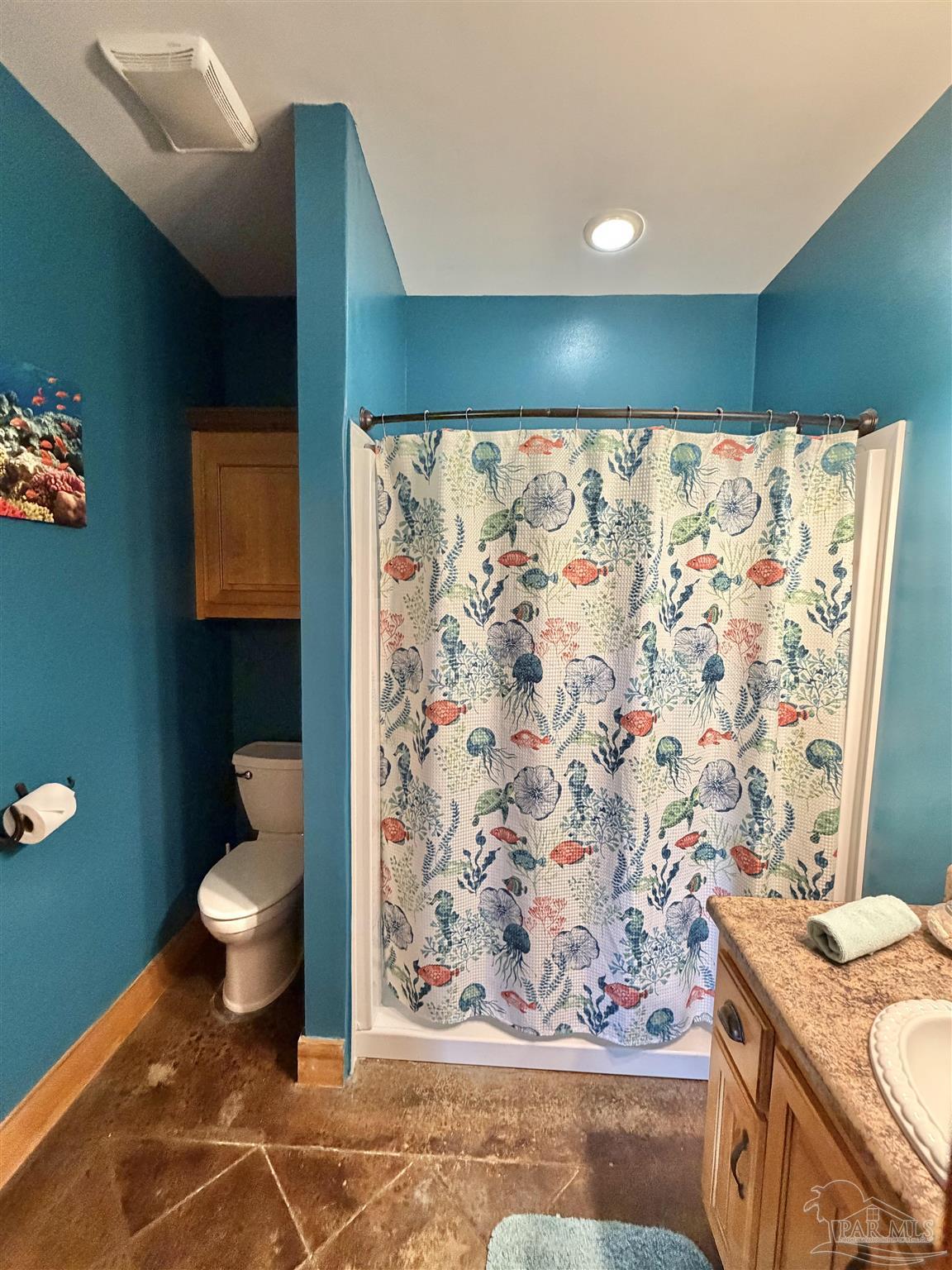 145 Tower Road Uriah, AL 36480 - Photo 16 of 72 a bathroom with a toilet and a shower curtain