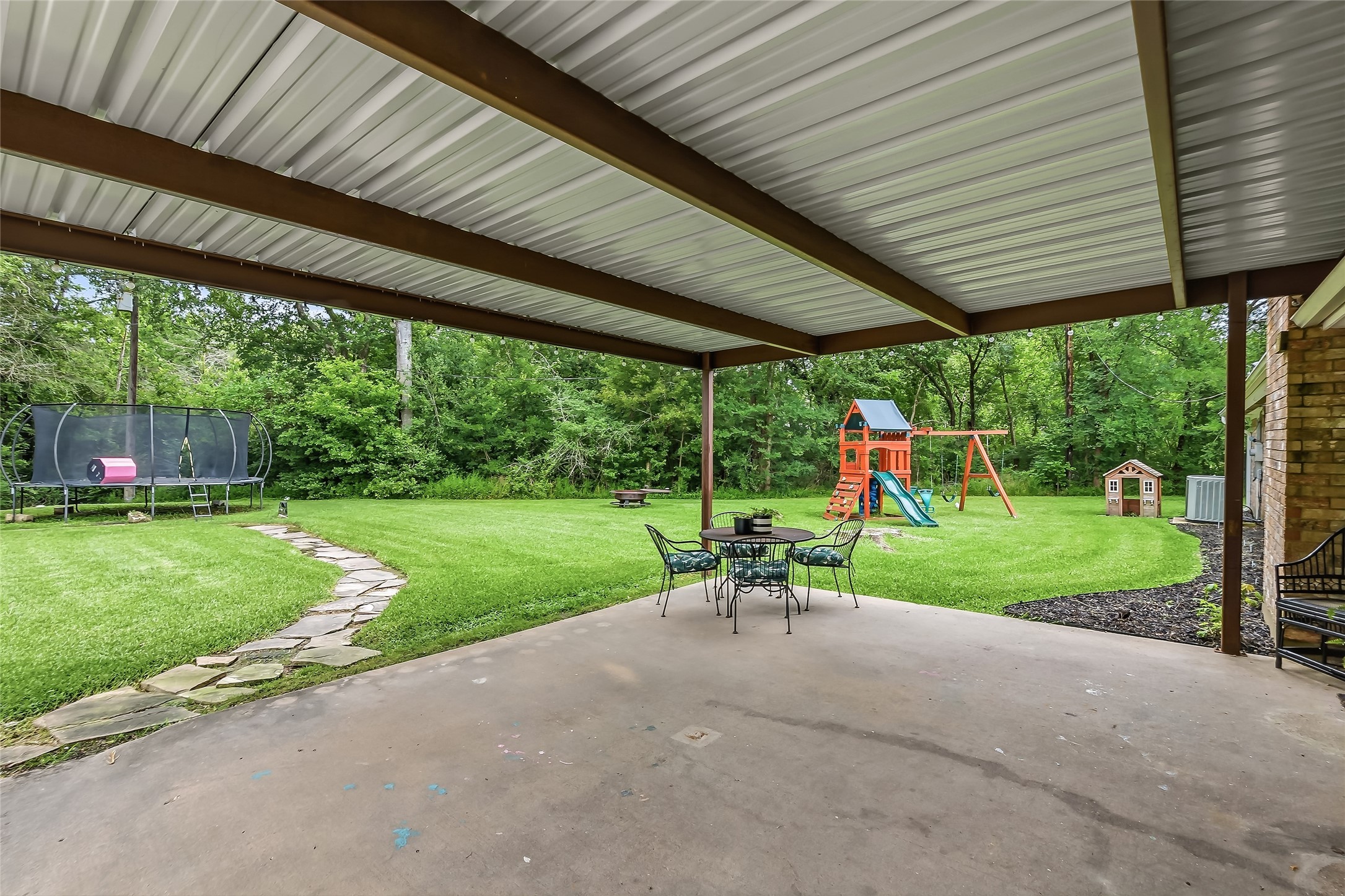 906 Standley Road Madisonville, TX 77864 - Photo 31 of 40 a view of garden with patio
