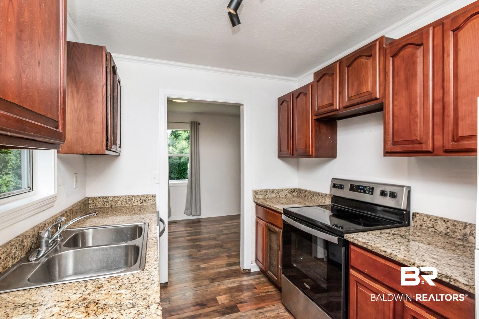 2905A McFarland Road, Unit F Mobile, AL 36695 - Photo 14 of 29 Kitchen featuring wood-finish cabinetry, granite-style countertops, stainless steel electric range, and a double basin sink