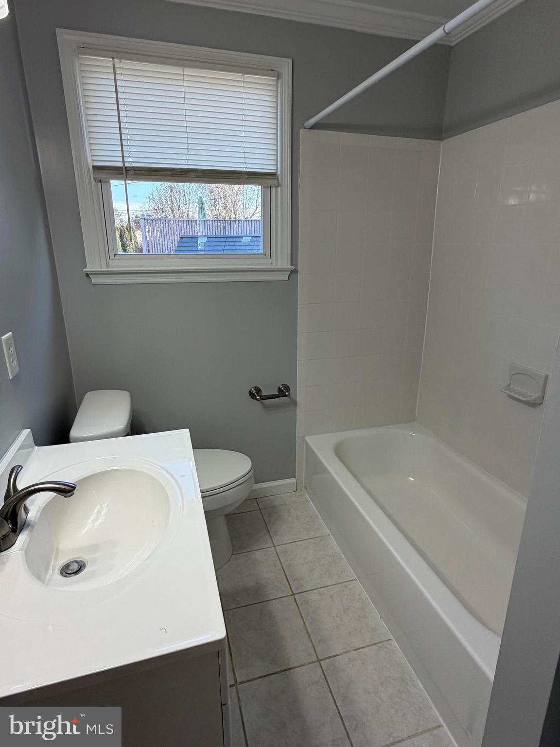 2630 Millcreek Road Wilmington, DE 19808 - Photo 13 of 26 a bathroom with a sink a toilet and bathtub