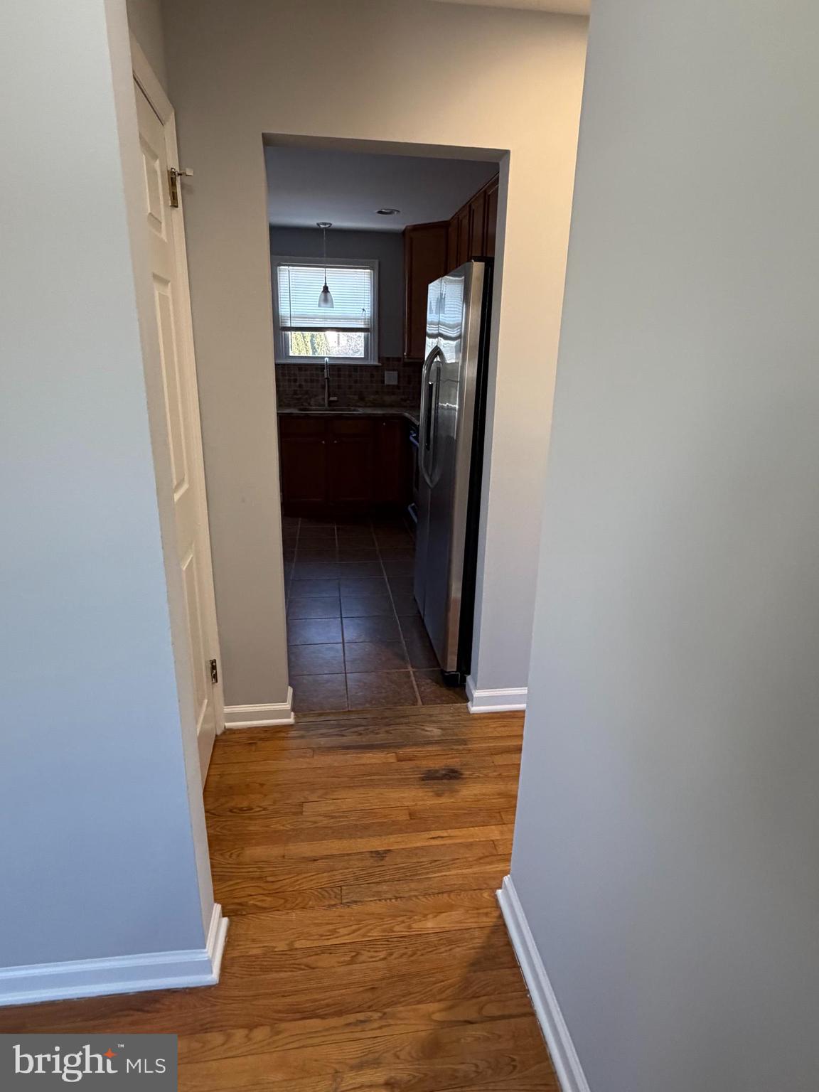 2630 Millcreek Road Wilmington, DE 19808 - Photo 5 of 26 a view of a hallway with wooden floor
