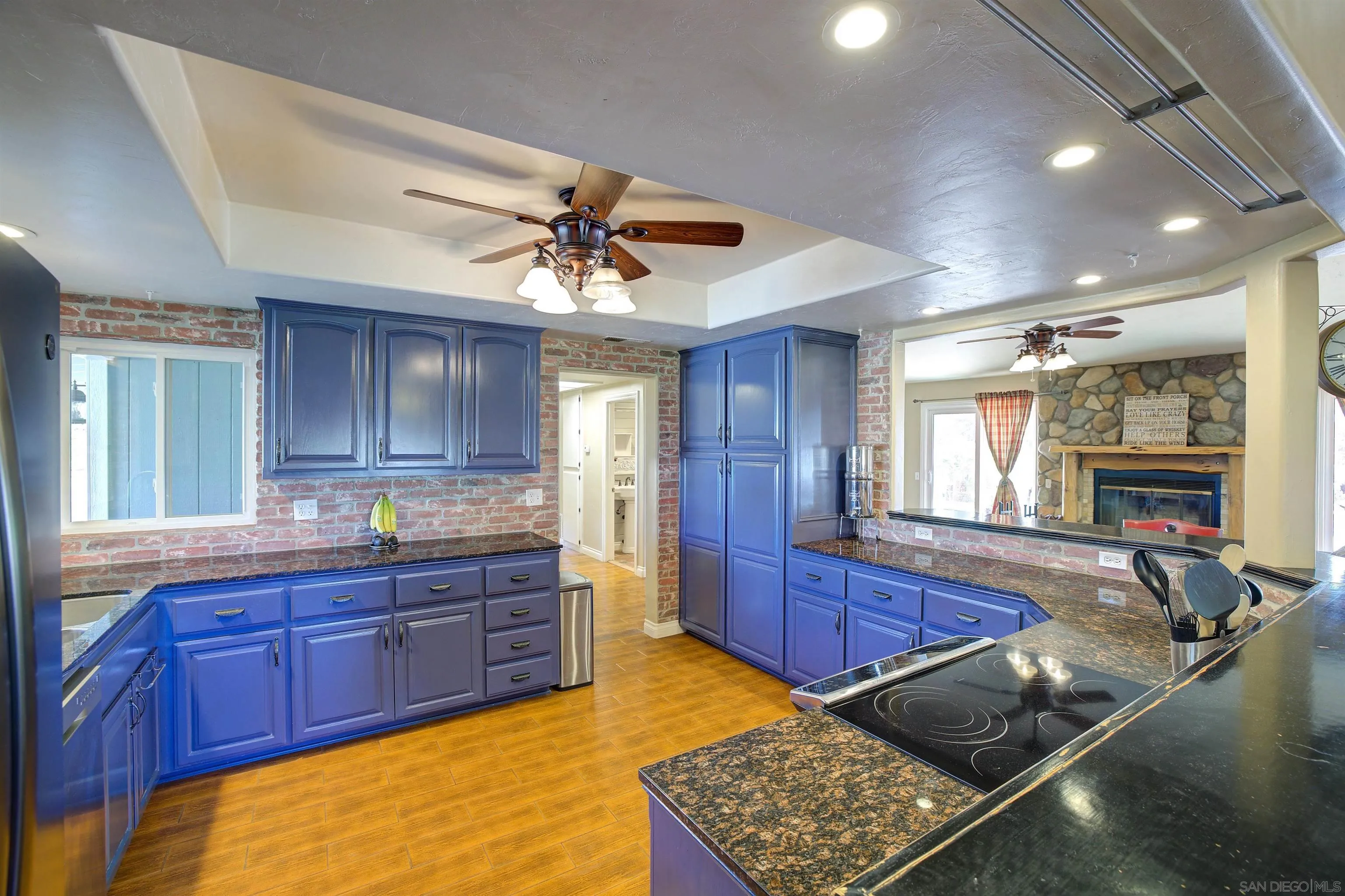 15835 Mactan Road Valley Center, CA 92082 - Photo 13 of 31 a room with wooden floors and windows