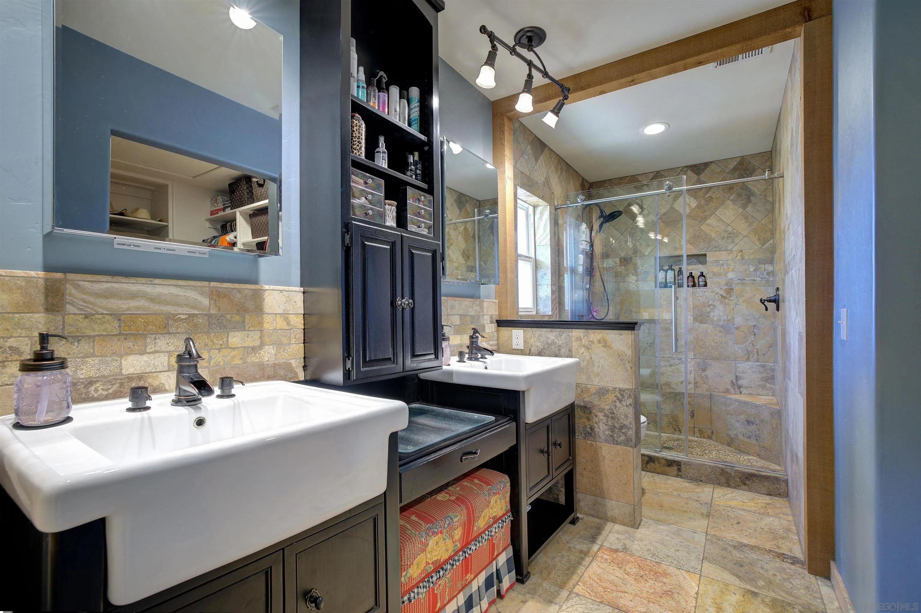 15835 Mactan Road Valley Center, CA 92082 - Photo 15 of 31 a bathroom with a sink and a mirror