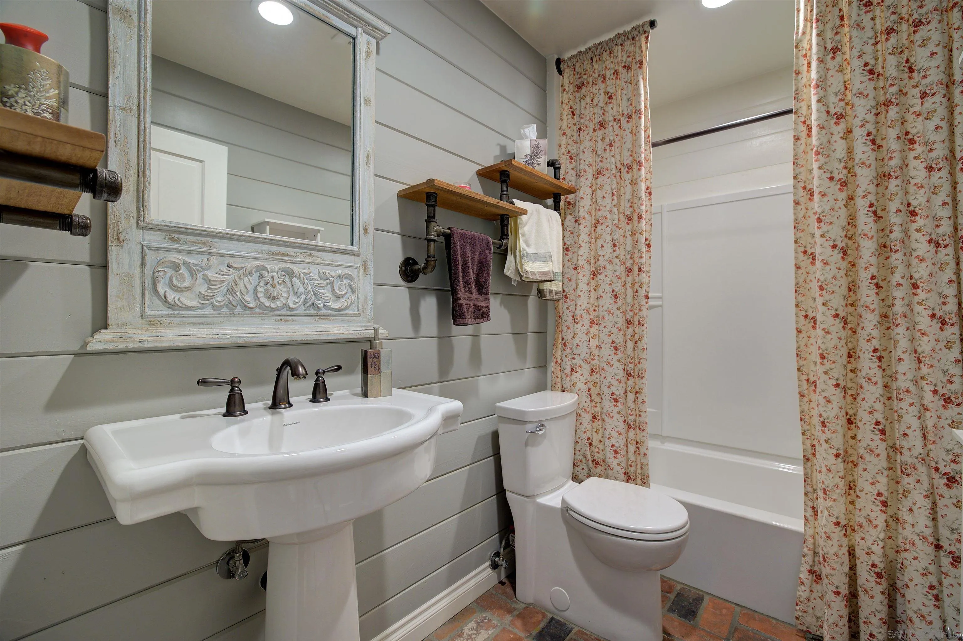 15835 Mactan Road Valley Center, CA 92082 - Photo 19 of 31 a bathroom with a sink toilet and shower