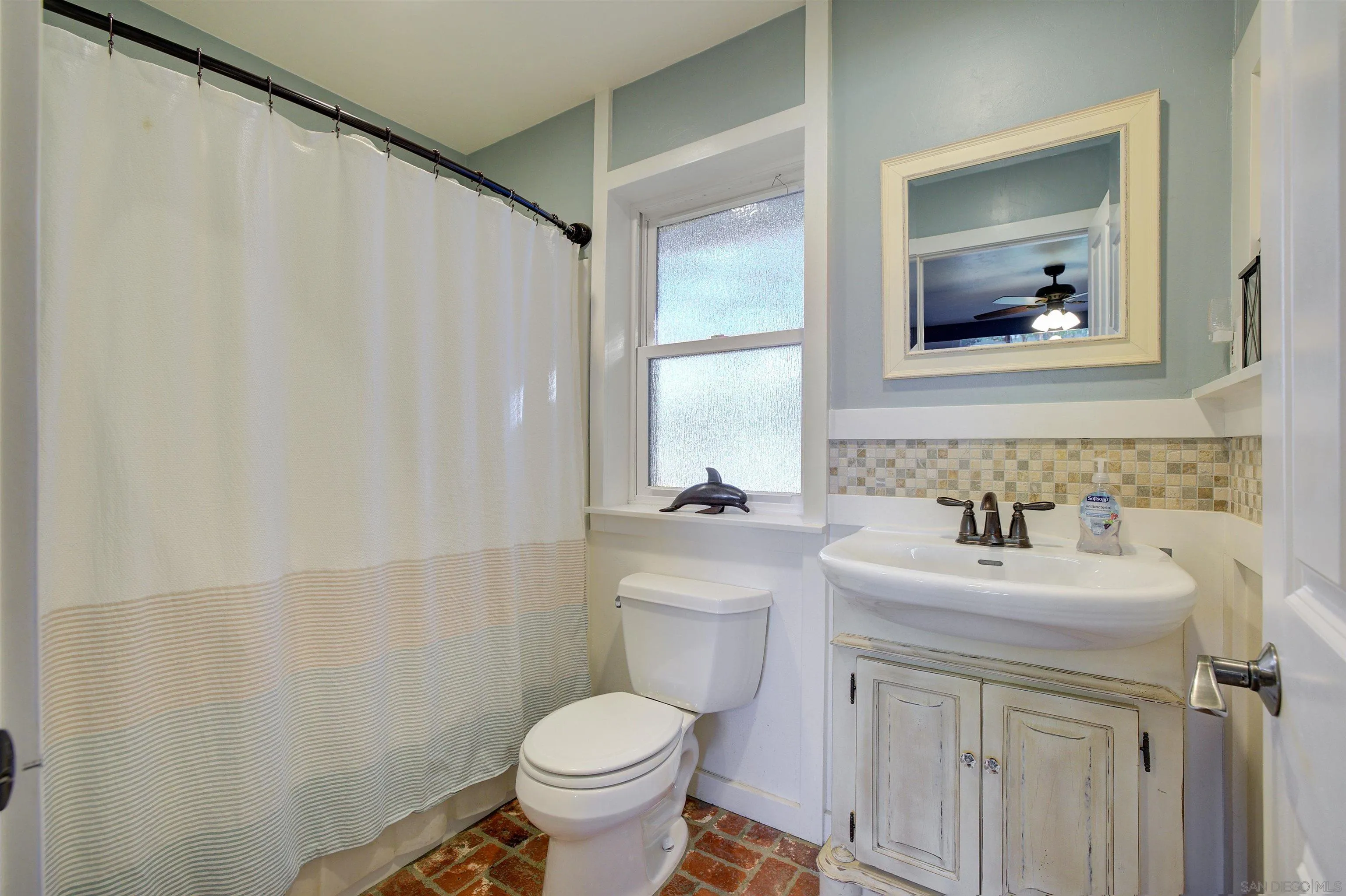 15835 Mactan Road Valley Center, CA 92082 - Photo 21 of 31 a bathroom with a sink toilet and mirror