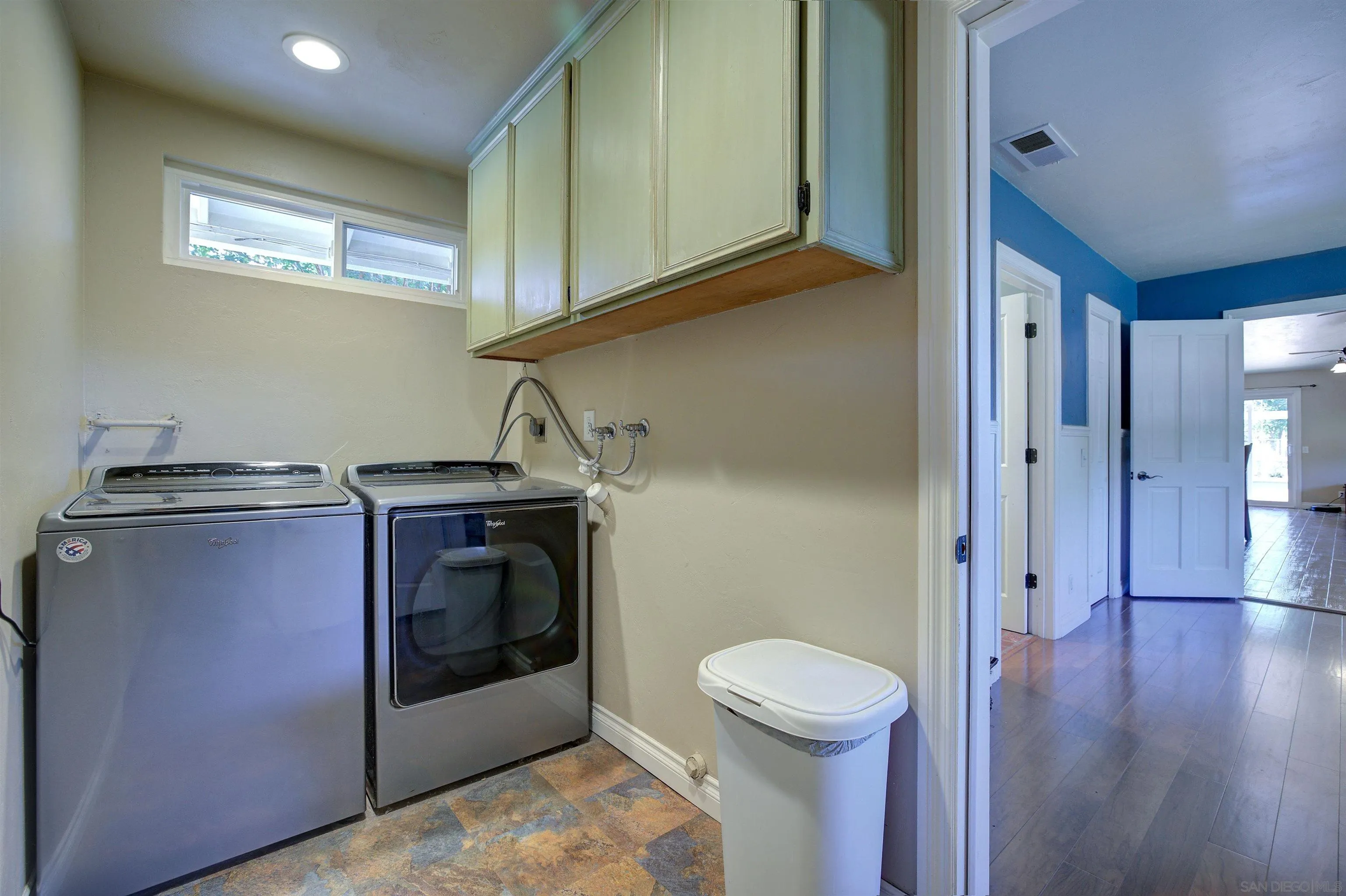 15835 Mactan Road Valley Center, CA 92082 - Photo 22 of 31 a hallway with washer and dryer