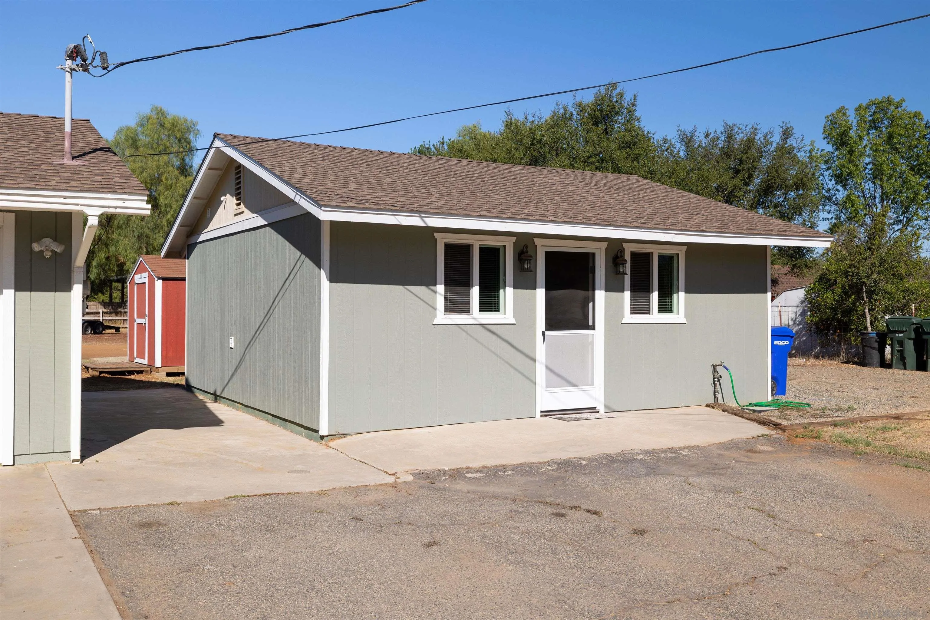 15835 Mactan Road Valley Center, CA 92082 - Photo 24 of 31 a view of a house with a backyard