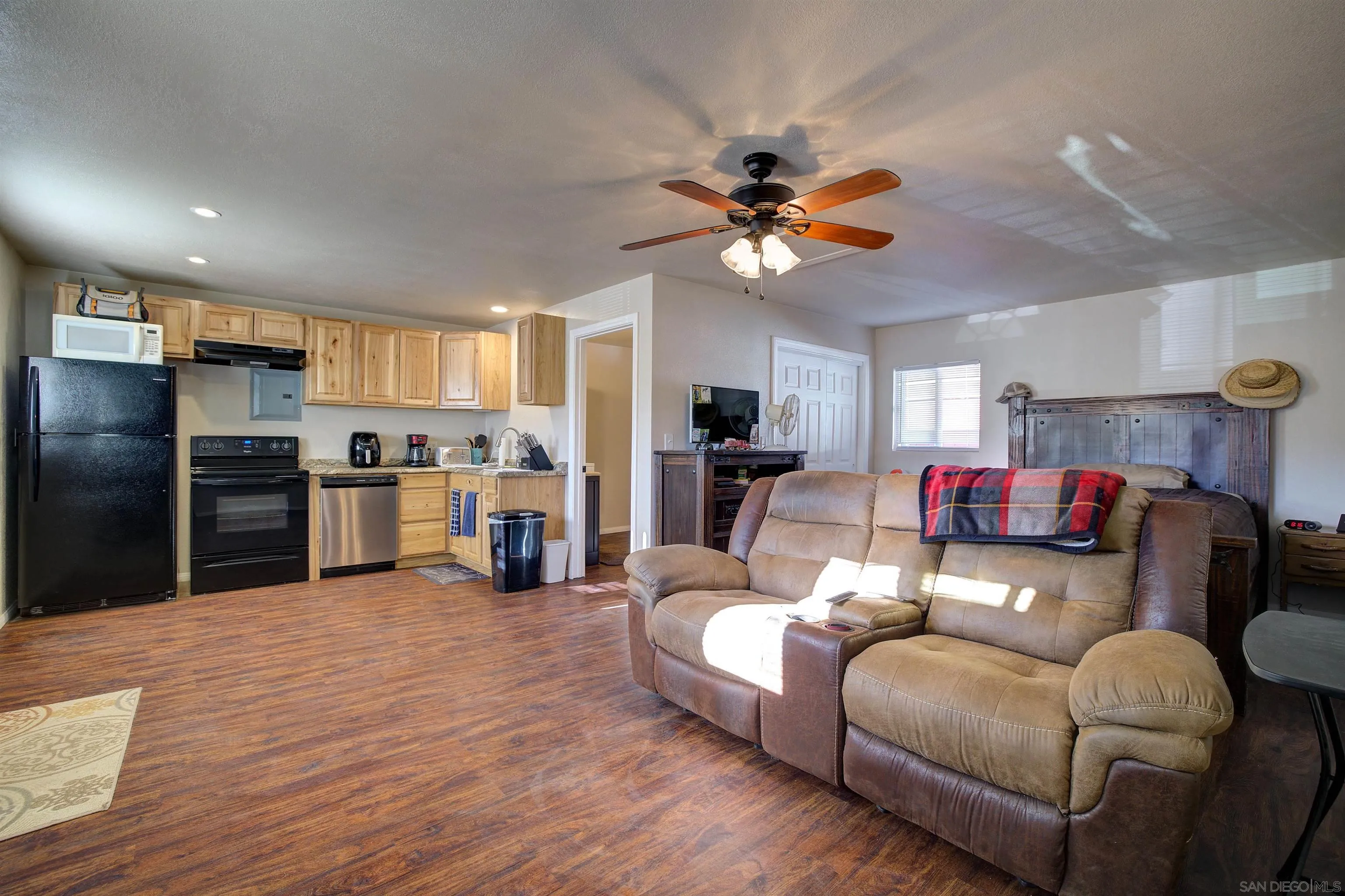 15835 Mactan Road Valley Center, CA 92082 - Photo 27 of 31 a living room with furniture and kitchen view