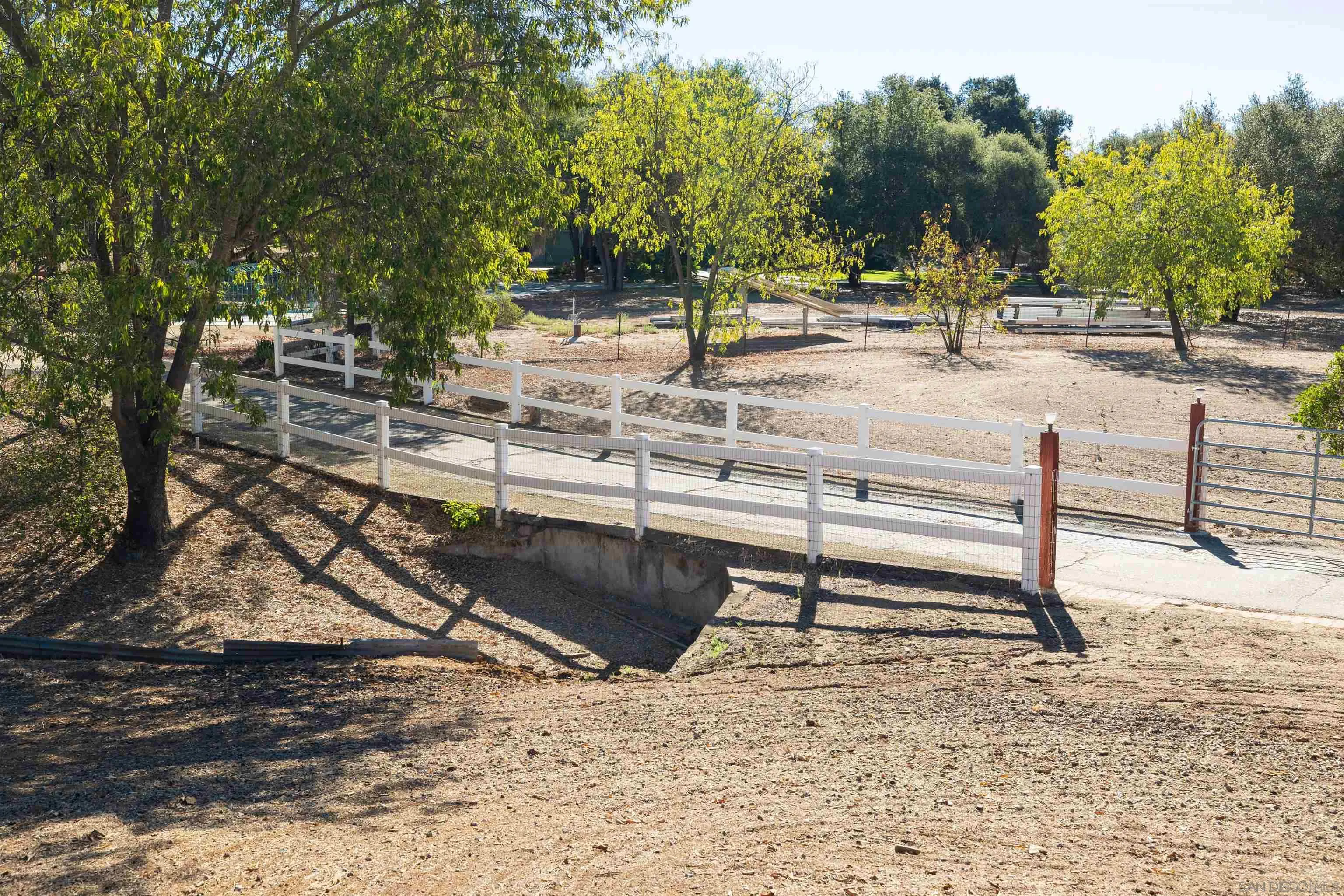 15835 Mactan Road Valley Center, CA 92082 - Photo 3 of 31 a view of a park with swings and slides