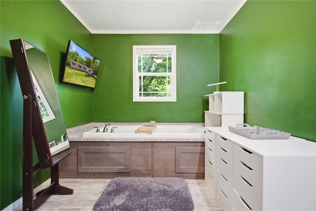 119 Fruit Mountain Road Easley, SC 29640 - Photo 5 of 31 This serene bathroom retreat features a built-in tub with a view, perfect for ultimate relaxation.
