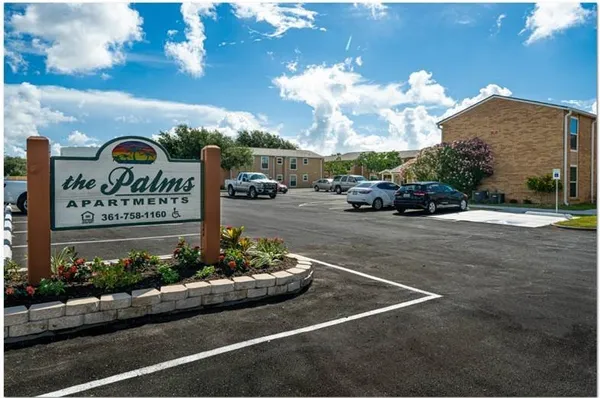 a view of a street with cars parked