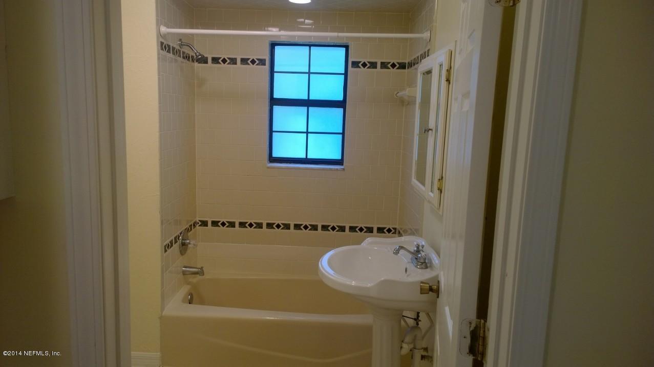13506 Yellow Bluff Road Jacksonville, FL 32226 - Photo 12 of 24 a bathroom with a sink and a shower