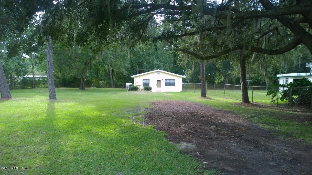 13506 Yellow Bluff Road Jacksonville, FL 32226 - Photo 24 of 24 a house with green field in front of it