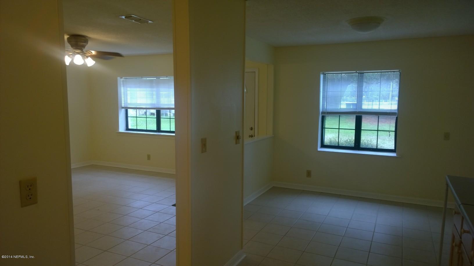 13506 Yellow Bluff Road Jacksonville, FL 32226 - Photo 5 of 24 a view of an empty room with a window