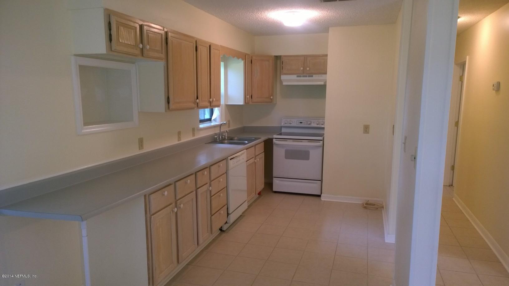 13506 Yellow Bluff Road Jacksonville, FL 32226 - Photo 6 of 24 a kitchen with stainless steel appliances a sink stove and cabinets