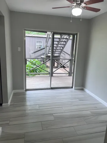 a view of an empty room with a window