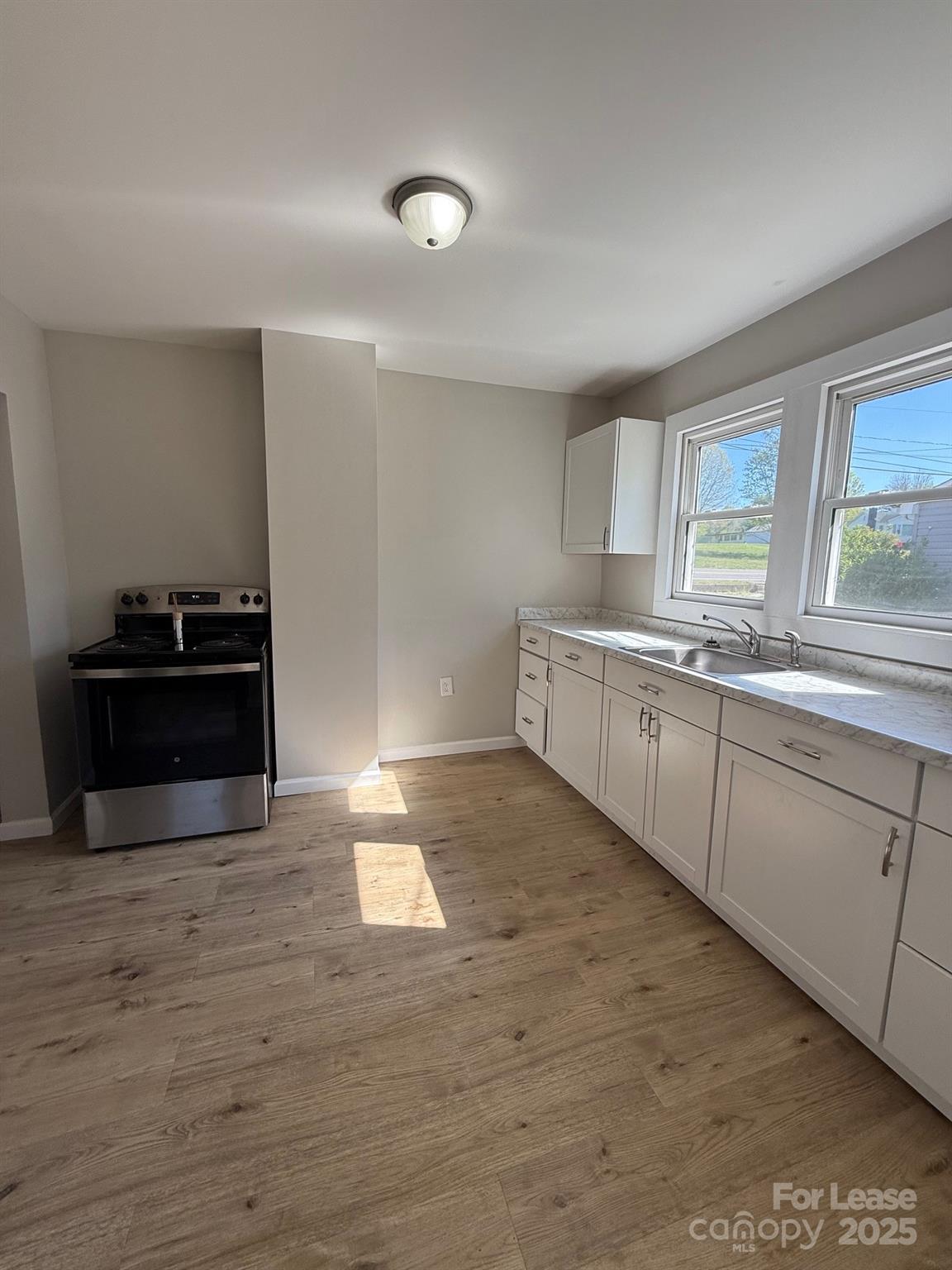 2140 Enon Road Morganton, NC 28655 - Photo 11 of 13 a kitchen with a sink and cabinets