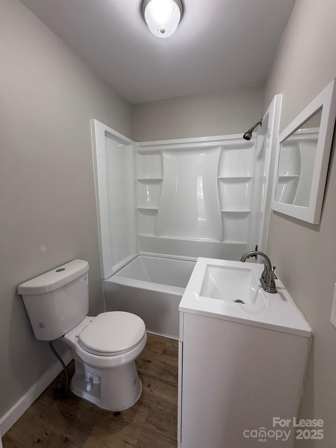 2140 Enon Road Morganton, NC 28655 - Photo 4 of 13 a white toilet sitting next to a bathroom sink