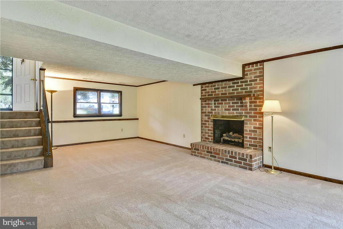107 Rutledge Road Queenstown, MD 21658 - Photo 15 of 30 Lower level Family Room with Fireplace