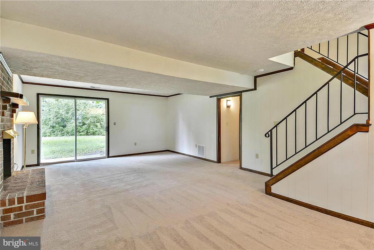 107 Rutledge Road Queenstown, MD 21658 - Photo 17 of 30 Lower level Family Room with Fireplace