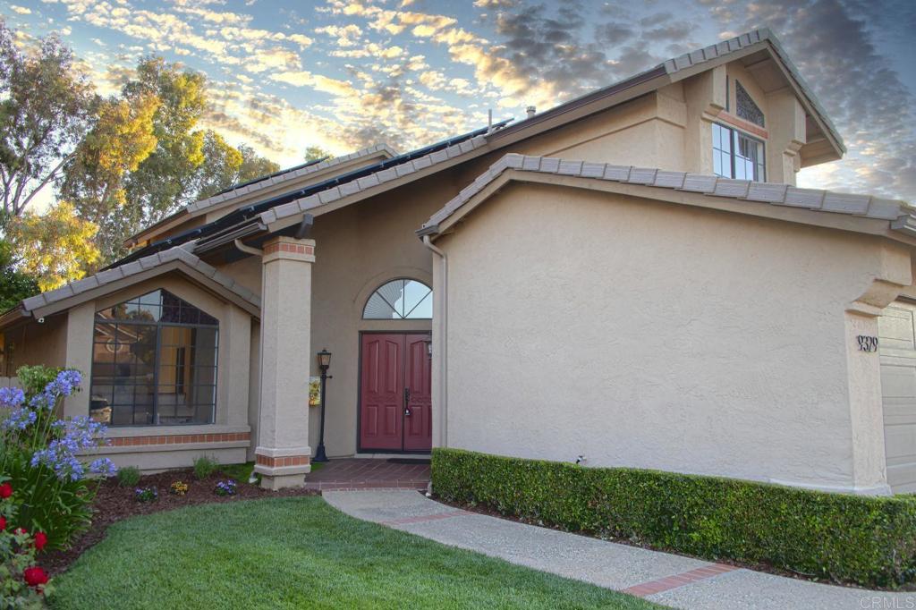 9329 Parus Point San Diego, CA 92129 - Photo 2 of 30 a view of a house with a small yard plants and a large tree