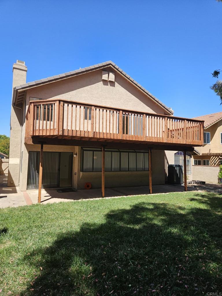 9329 Parus Point San Diego, CA 92129 - Photo 24 of 30 a view of a house with a yard and a large tree
