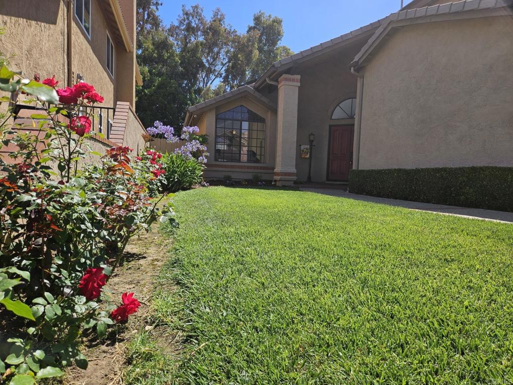 9329 Parus Point San Diego, CA 92129 - Photo 27 of 30 a view of a house with a yard and garden