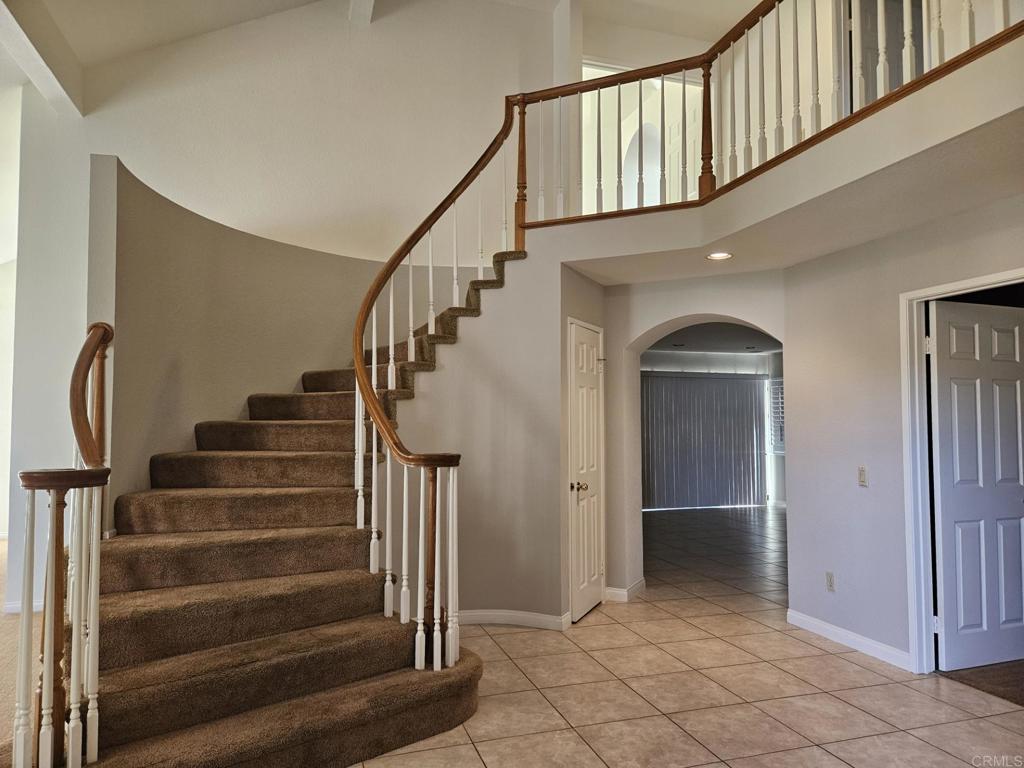9329 Parus Point San Diego, CA 92129 - Photo 3 of 30 a view of entryway and hall with wooden floor