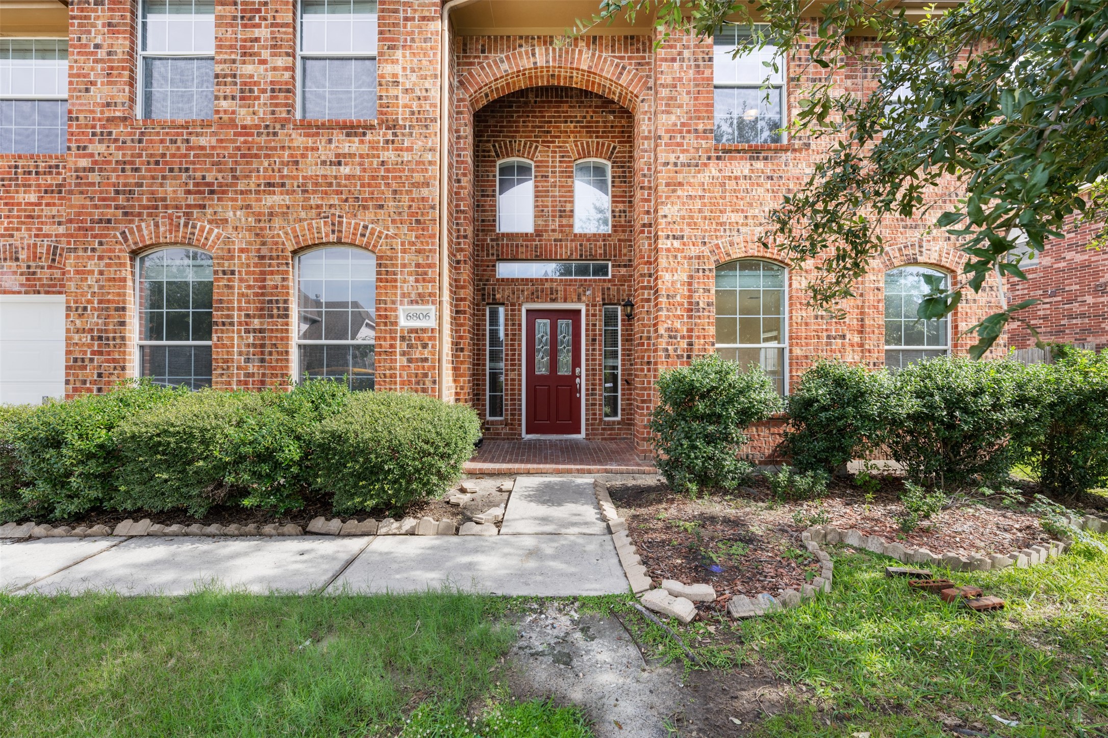 6806 Stableton Lane Houston, TX 77049 - Photo 1 of 50 a front view of a house with yard and green space