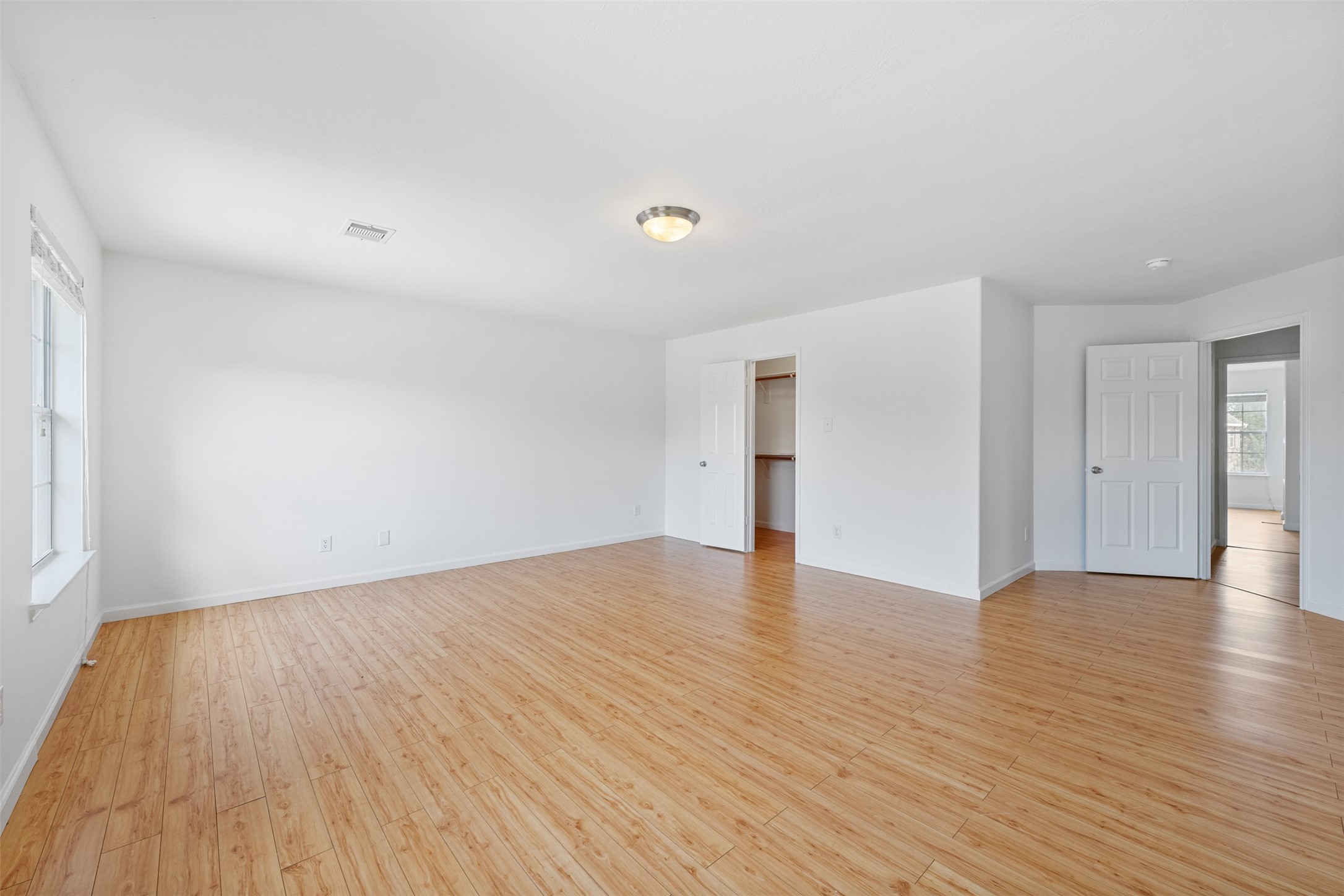 6806 Stableton Lane Houston, TX 77049 - Photo 12 of 50 a view of an empty room and wooden floor