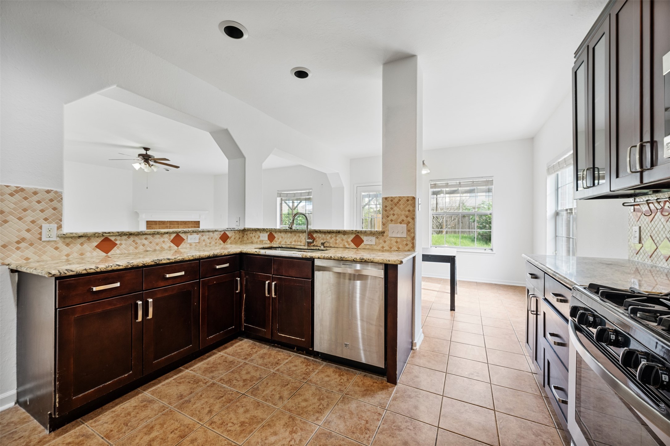 6806 Stableton Lane Houston, TX 77049 - Photo 20 of 50 a kitchen with a sink stove and cabinets