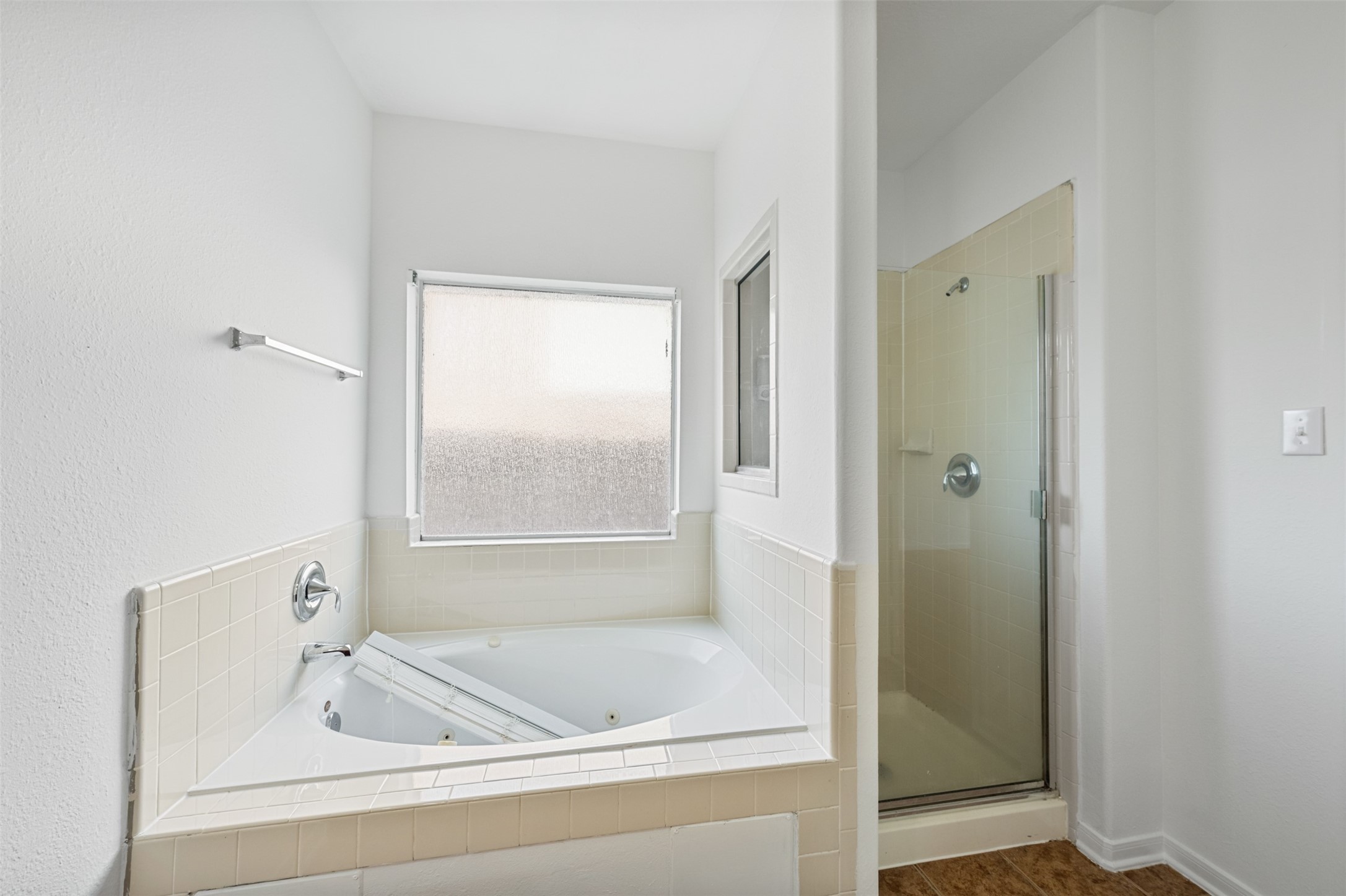 6806 Stableton Lane Houston, TX 77049 - Photo 24 of 50 a bathroom with a bathtub and a shower