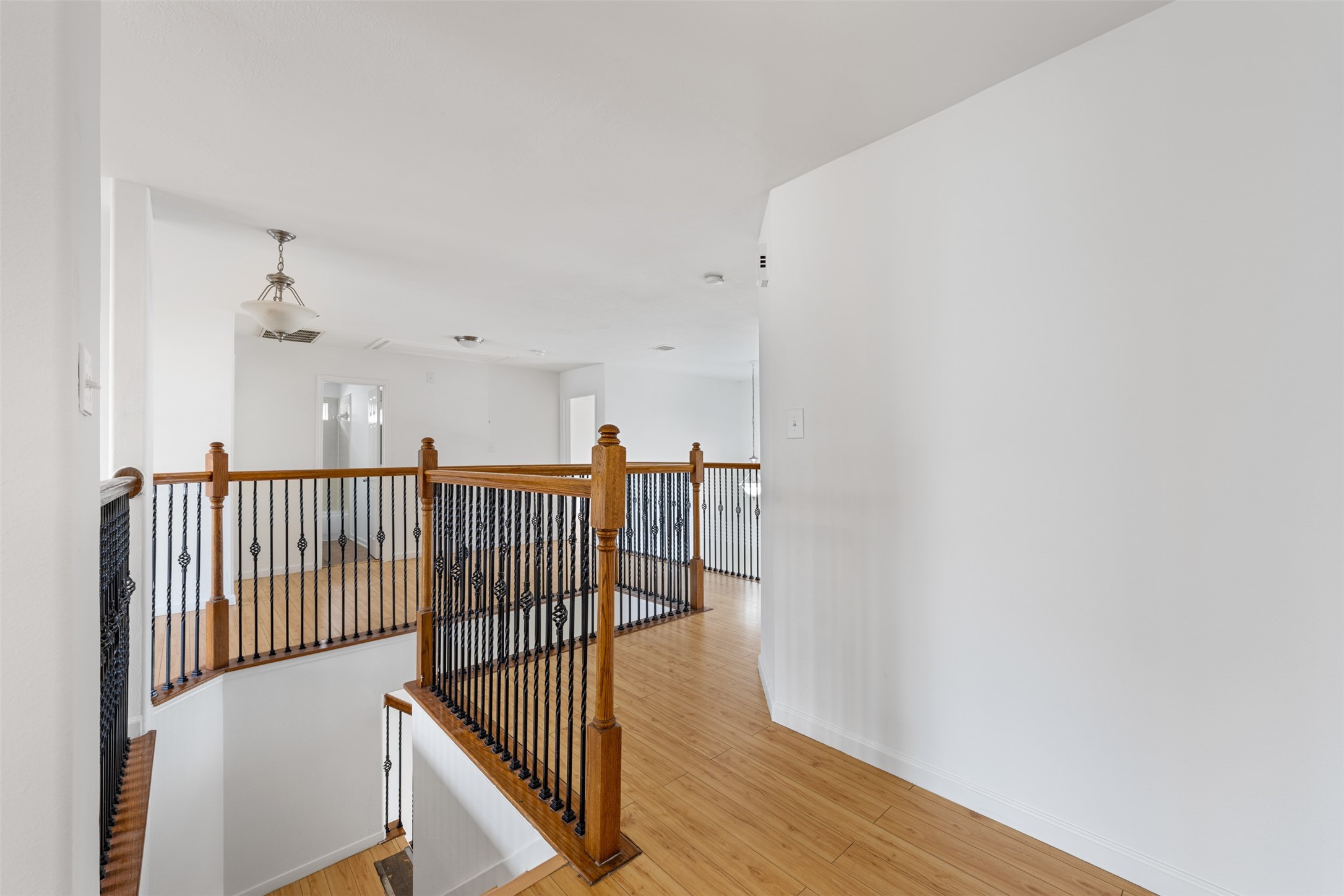 6806 Stableton Lane Houston, TX 77049 - Photo 27 of 50 a view of a hallway with wooden floor