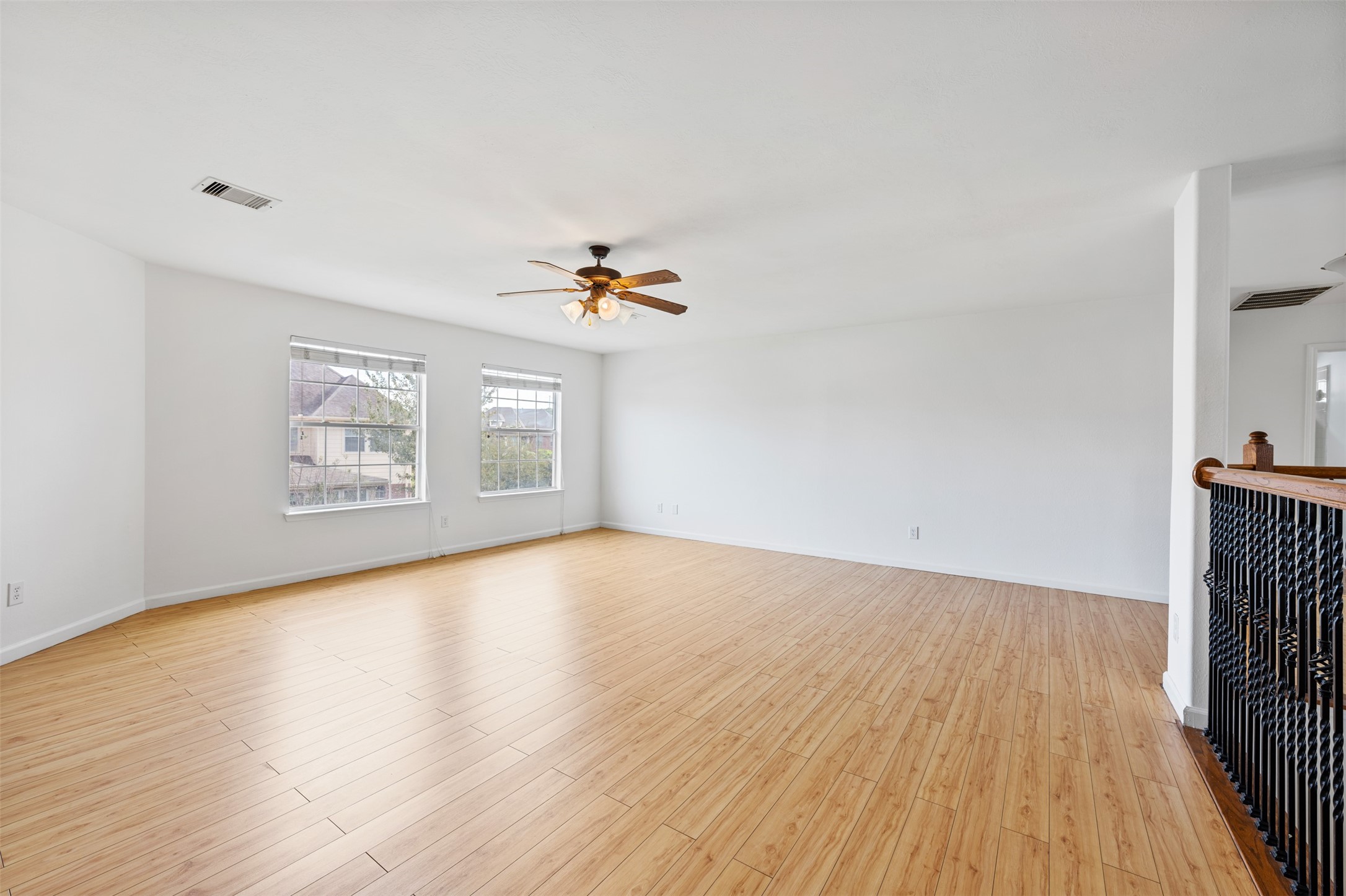 6806 Stableton Lane Houston, TX 77049 - Photo 28 of 50 a view of an empty room with wooden floor and a window