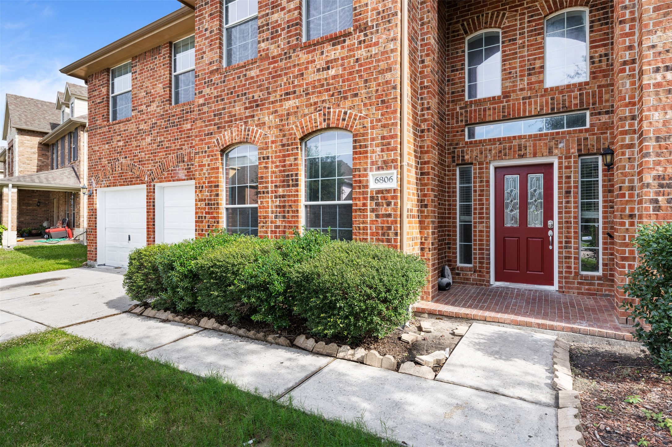 6806 Stableton Lane Houston, TX 77049 - Photo 3 of 50 a view of a brick building next to a yard