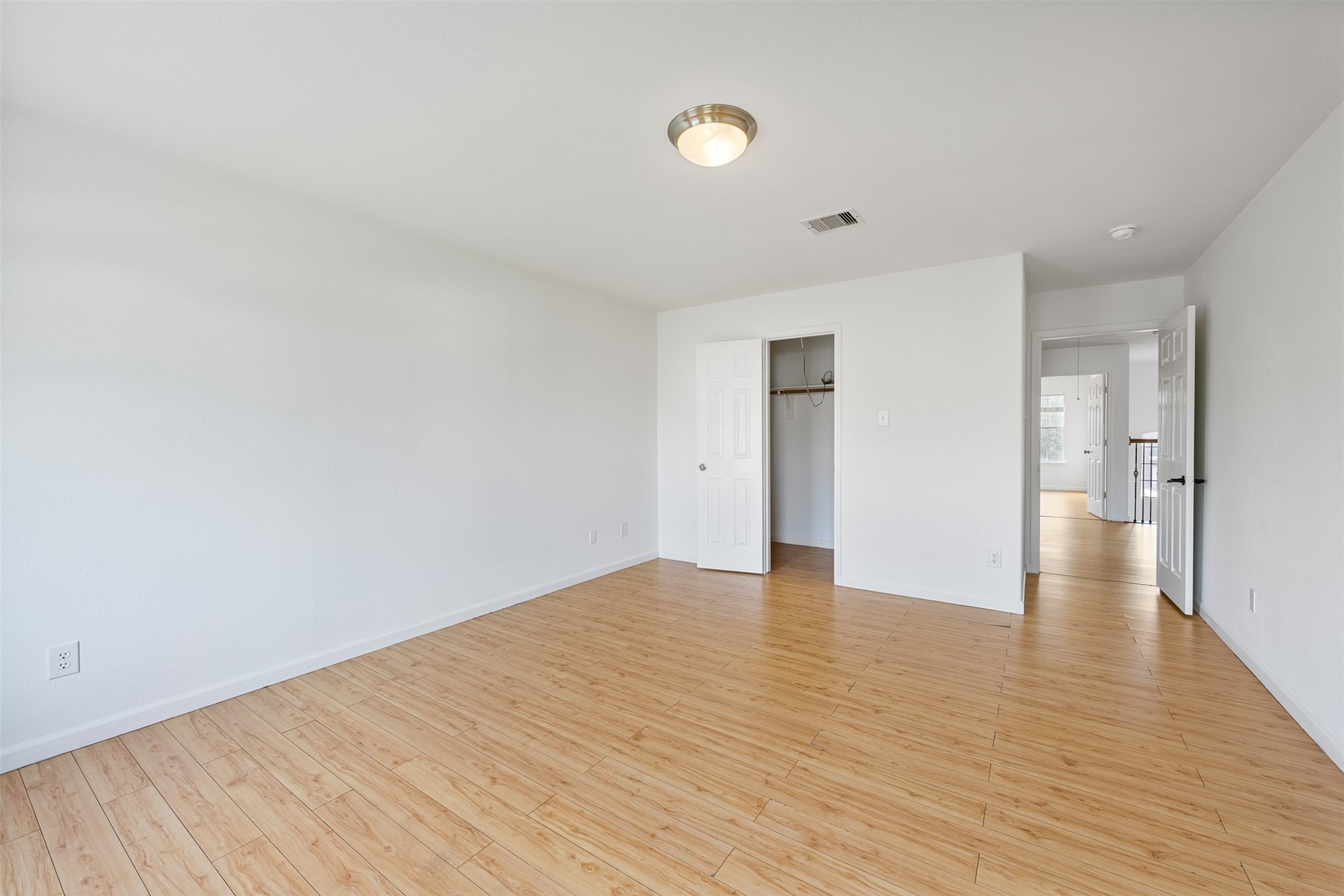 6806 Stableton Lane Houston, TX 77049 - Photo 33 of 50 a view of an empty room with wooden floor and a window