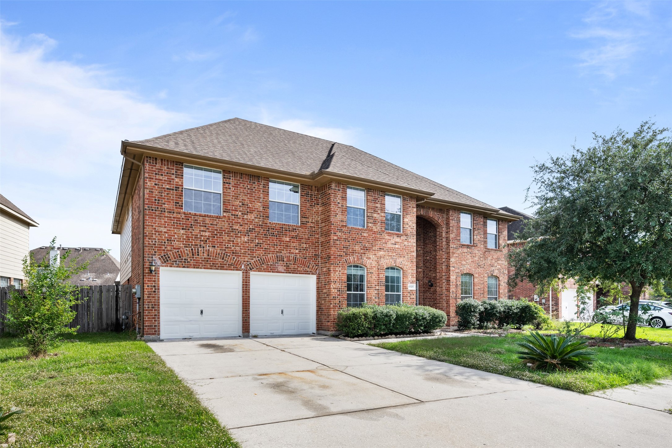 6806 Stableton Lane Houston, TX 77049 - Photo 4 of 50 a front view of a house with a yard