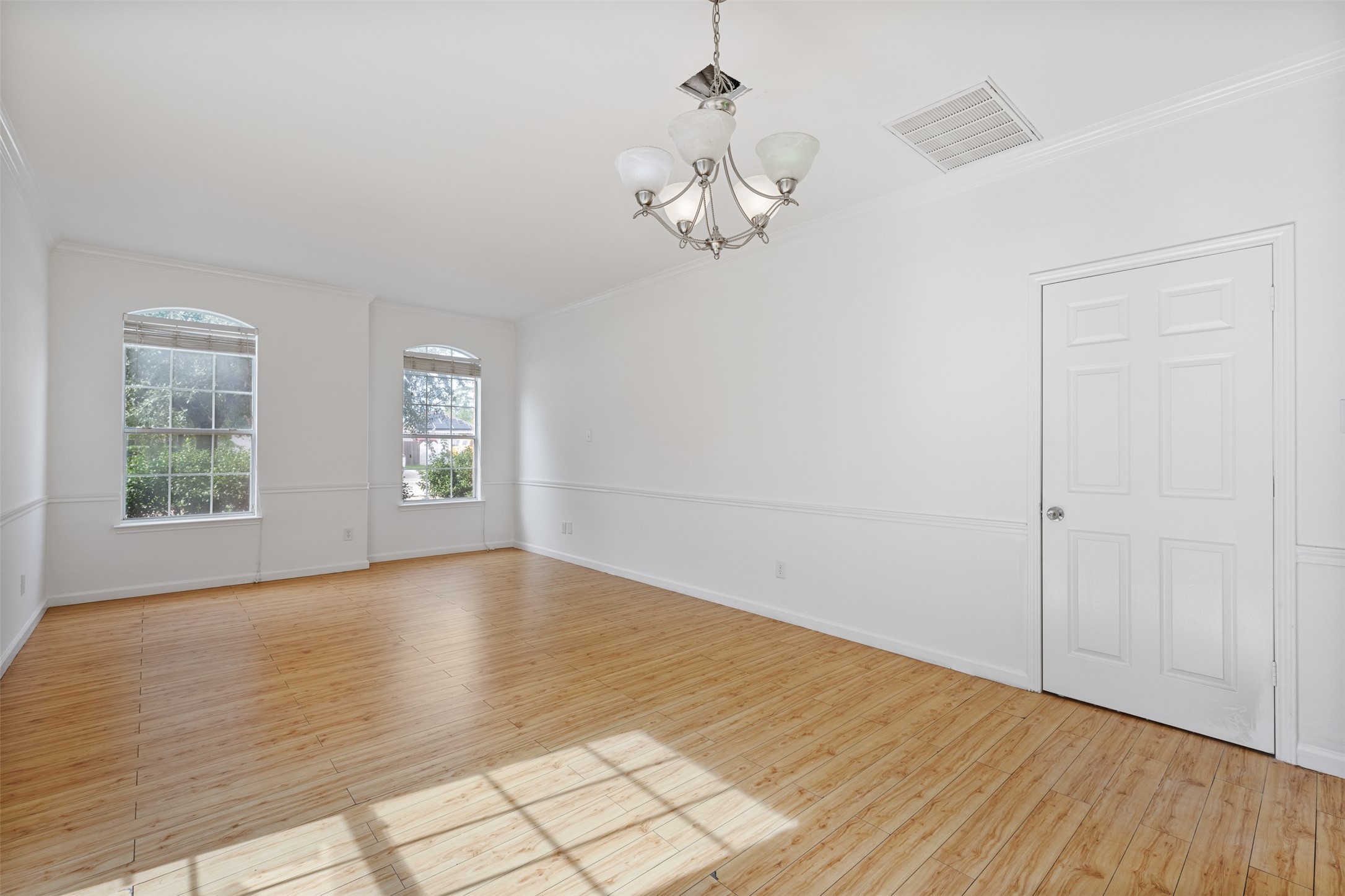 6806 Stableton Lane Houston, TX 77049 - Photo 43 of 50 a view of empty room with wooden floor and window