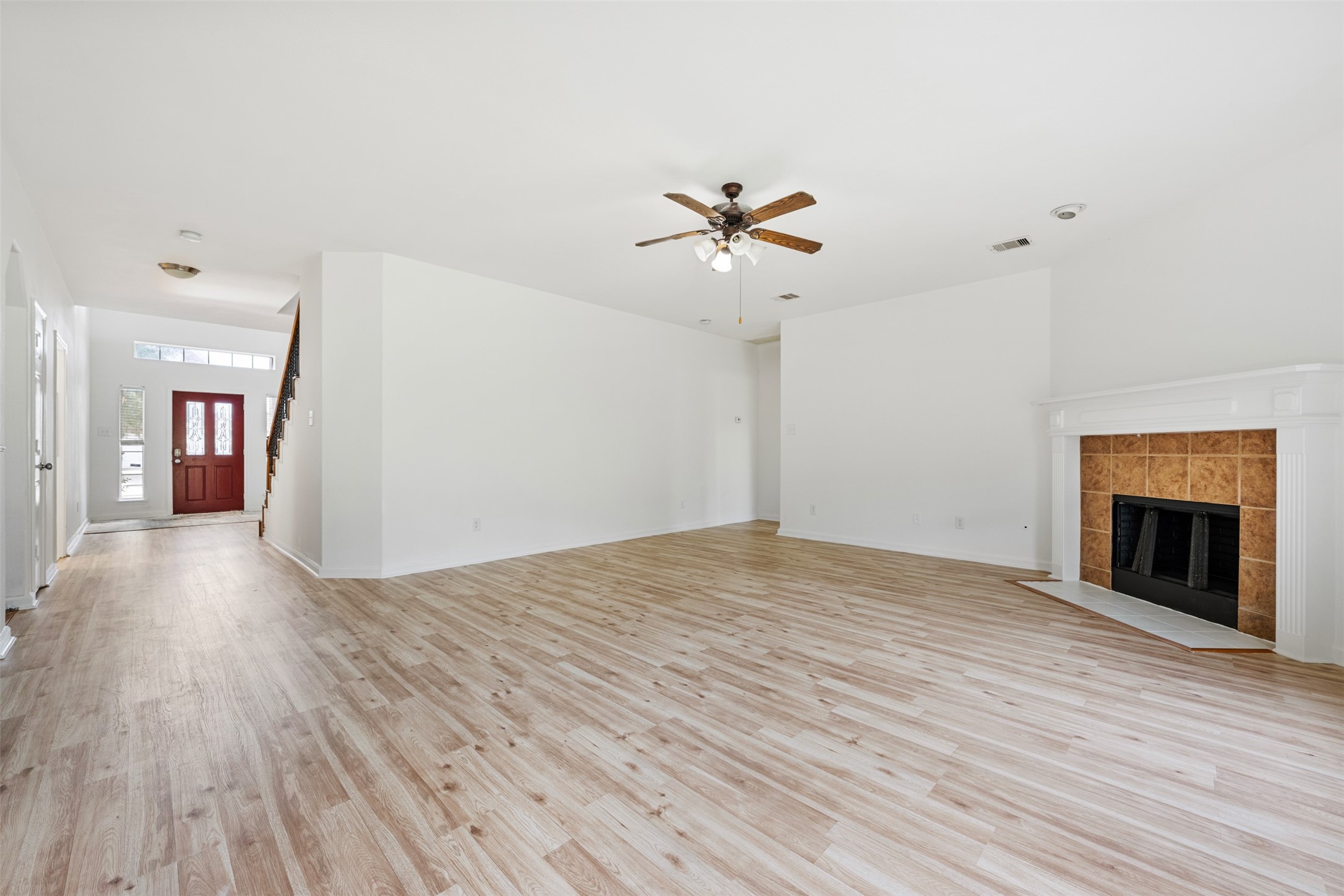 6806 Stableton Lane Houston, TX 77049 - Photo 45 of 50 a view of empty room with wooden floor and fireplace