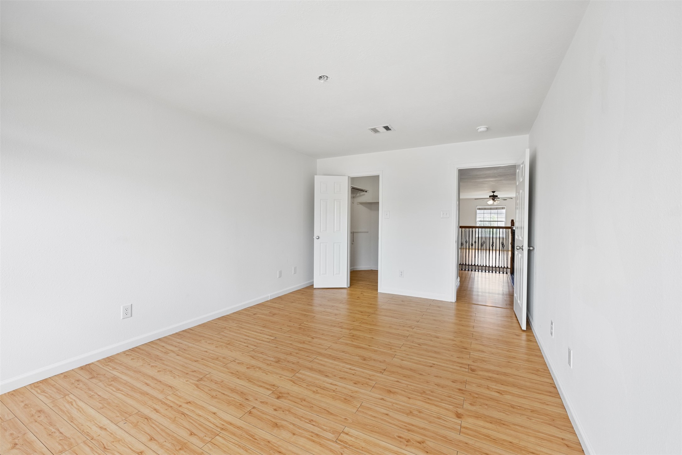 6806 Stableton Lane Houston, TX 77049 - Photo 10 of 50 a view of an empty room with wooden floor