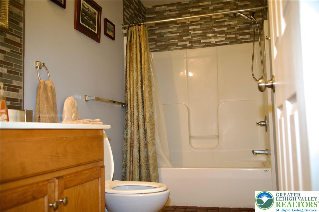 101 Cider Mill Road Mertztown, PA 19539 - Photo 11 of 26 a bathroom with a sink toilet and shower