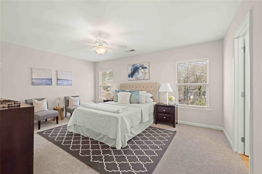 3489 Fairview Road, Unit MAGNOLIA Covington, GA 30016 - Photo 14 of 29 a bedroom with double bed windows and a chandelier