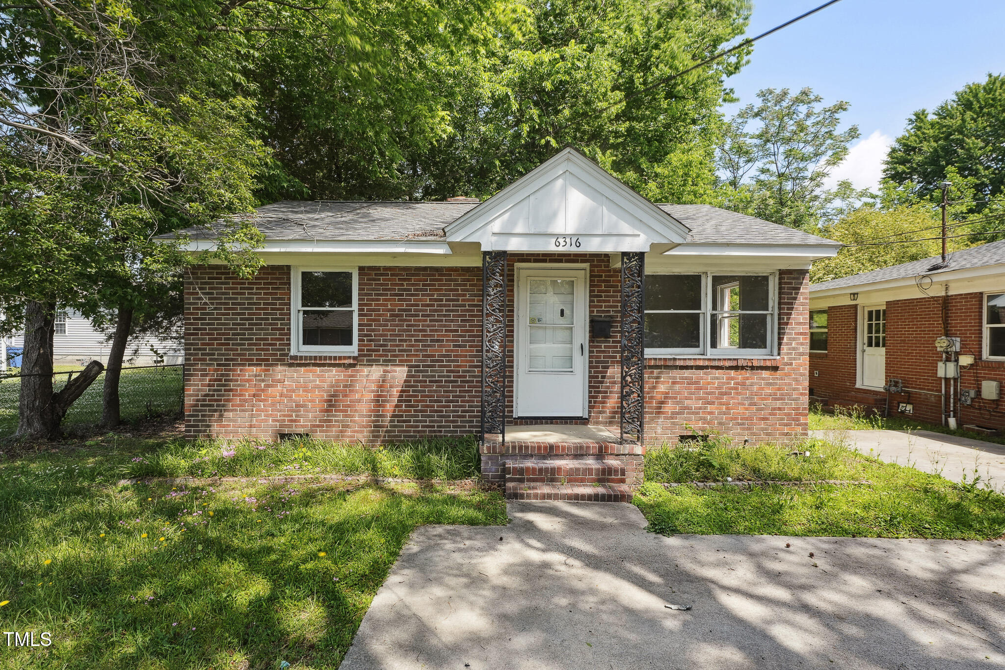 6316 Ward Boulevard Wilson, NC 27893 - Photo 1 of 36 a front view of a house with yard and green space