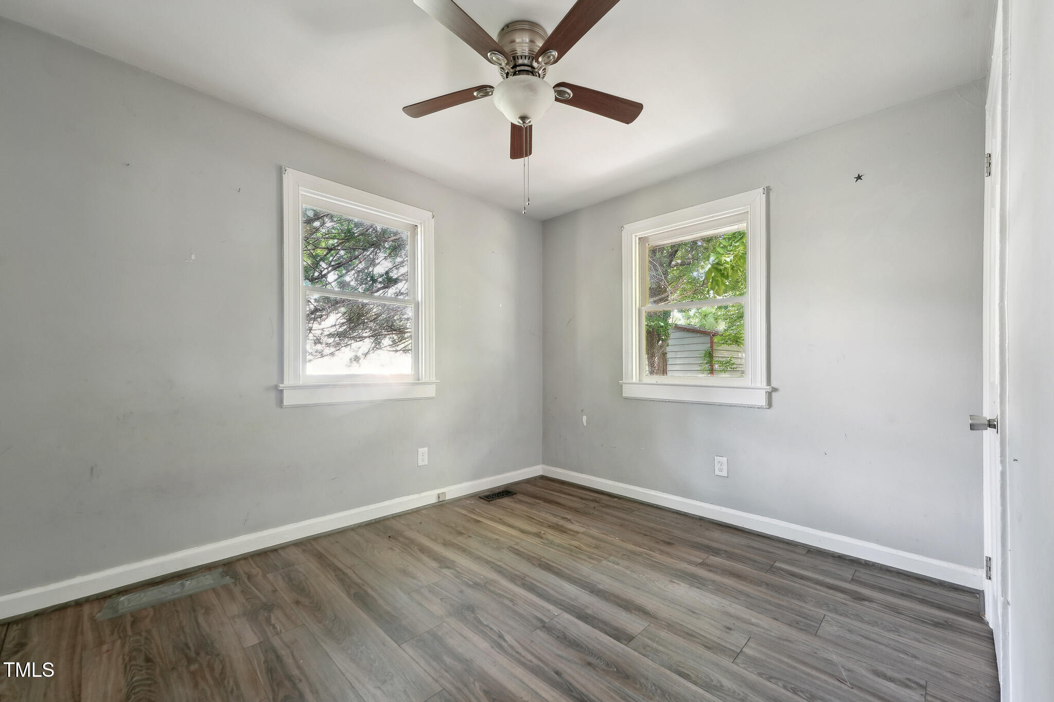 6316 Ward Boulevard Wilson, NC 27893 - Photo 11 of 36 a view of a big room with wooden floor and windows
