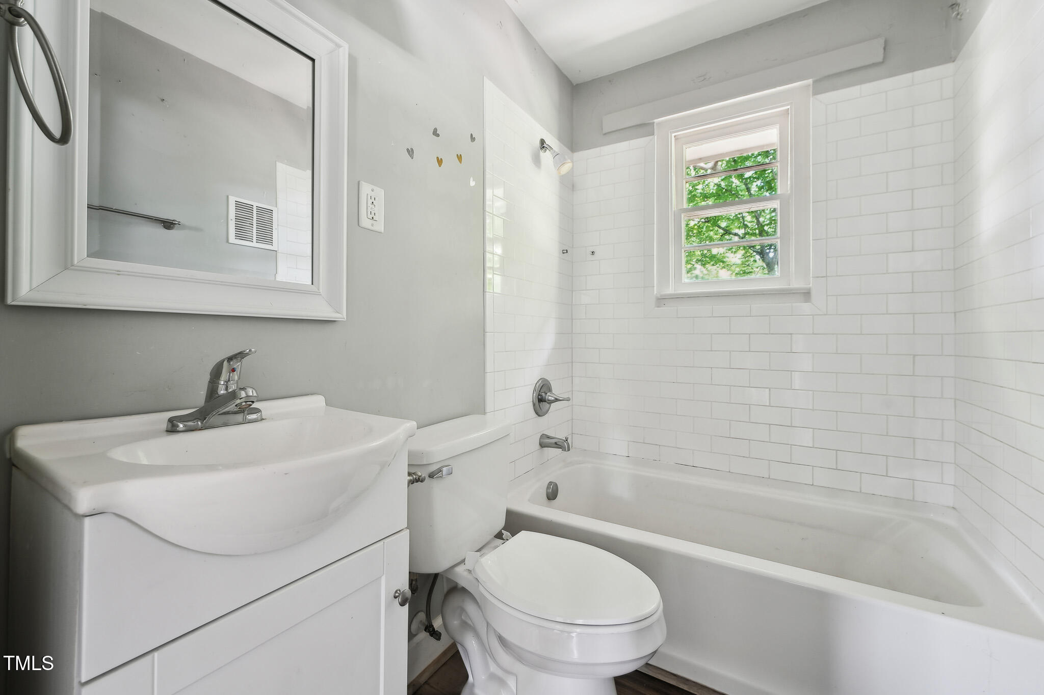 6316 Ward Boulevard Wilson, NC 27893 - Photo 13 of 36 a bathroom with a sink toilet and shower