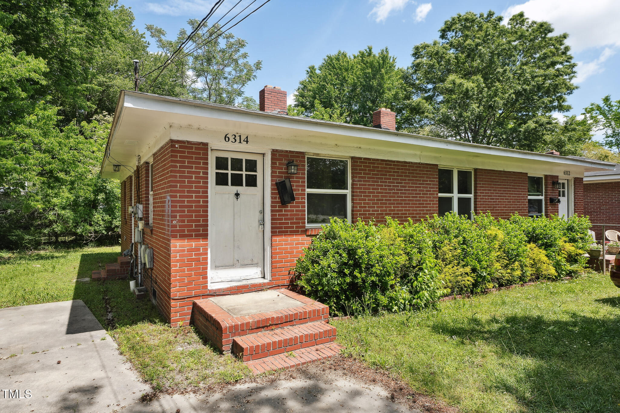 6316 Ward Boulevard Wilson, NC 27893 - Photo 17 of 36 a front view of a house with garden