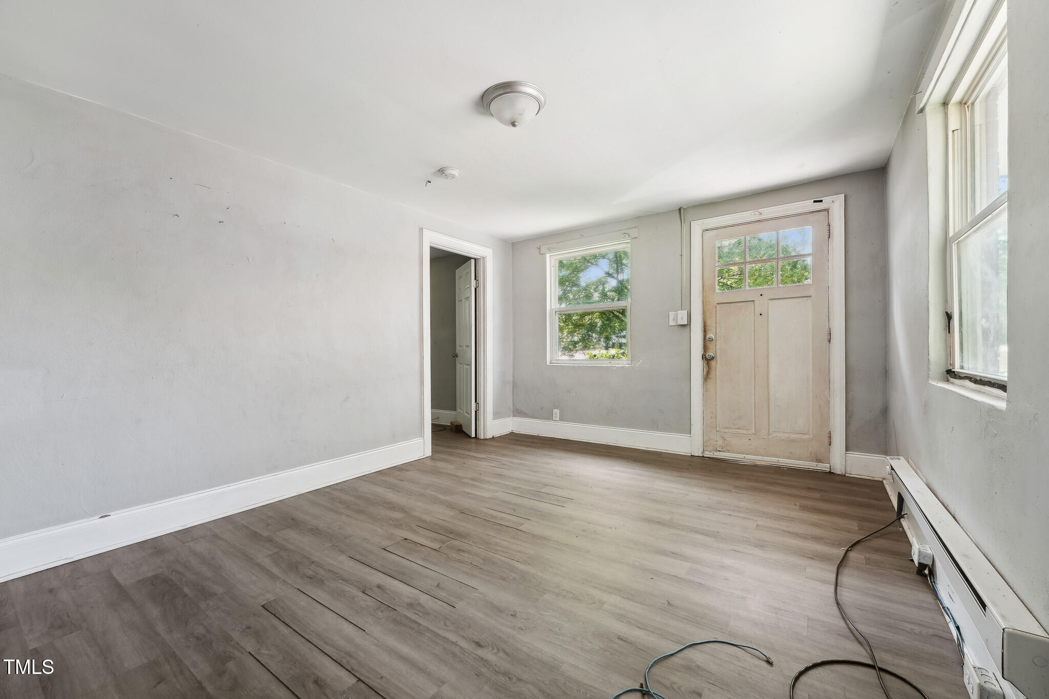 6316 Ward Boulevard Wilson, NC 27893 - Photo 21 of 36 wooden floor in an empty room with a window