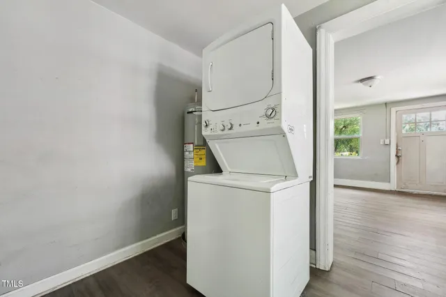 a kitchen with stainless steel appliances granite countertop a stove a microwave and a sink