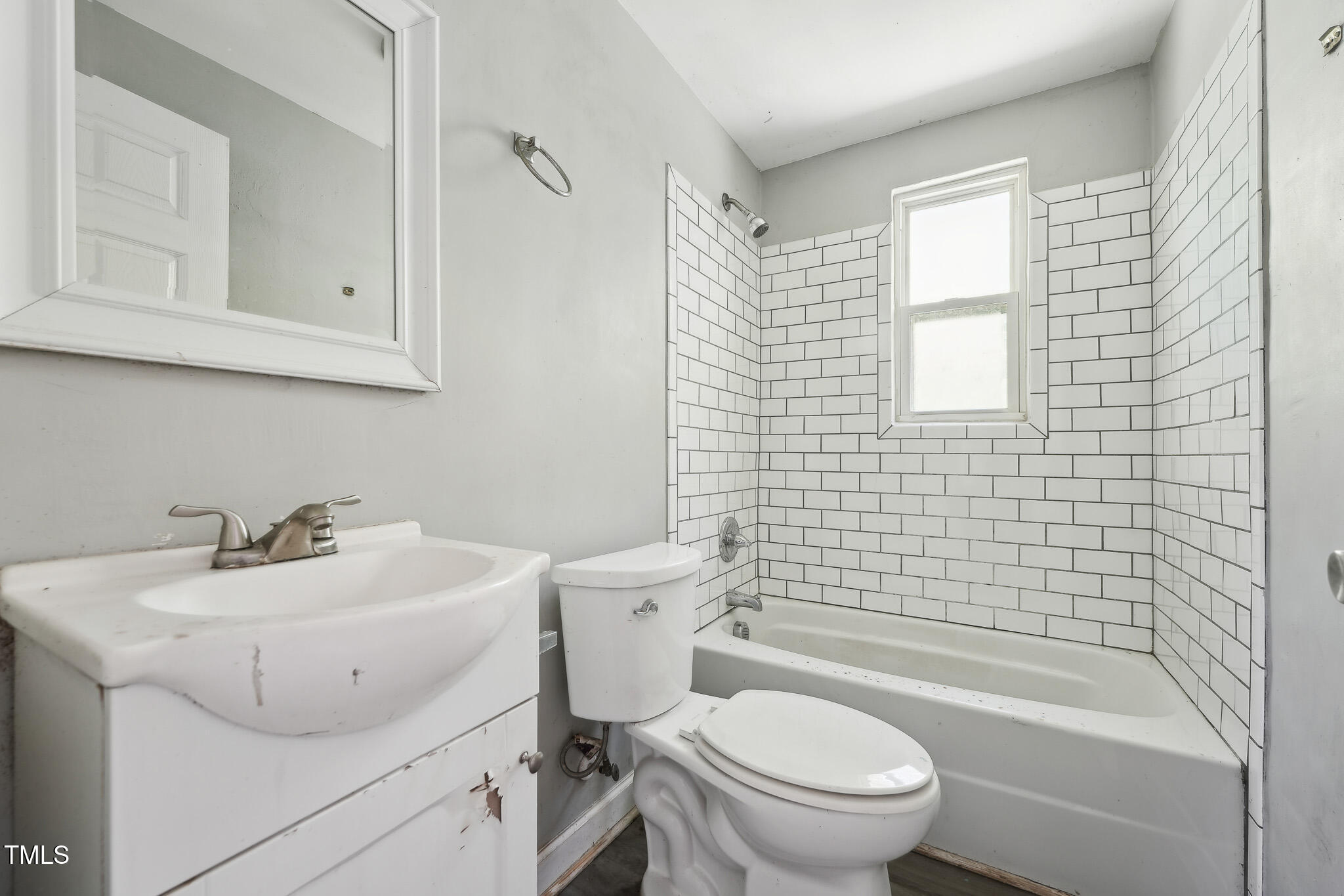 6316 Ward Boulevard Wilson, NC 27893 - Photo 25 of 36 a bathroom with a sink a toilet and shower