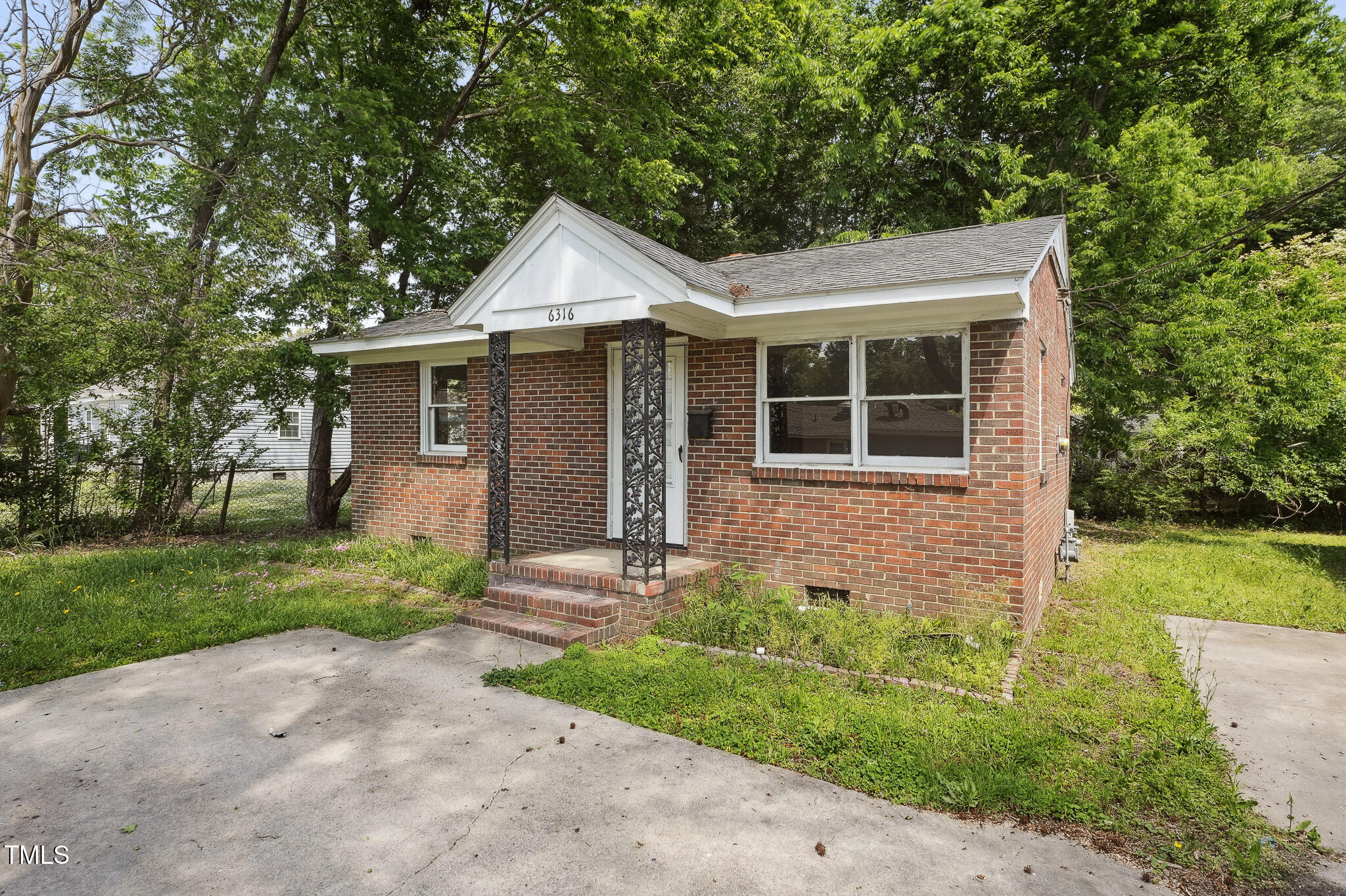 6316 Ward Boulevard Wilson, NC 27893 - Photo 2 of 36 a front view of a house with garden